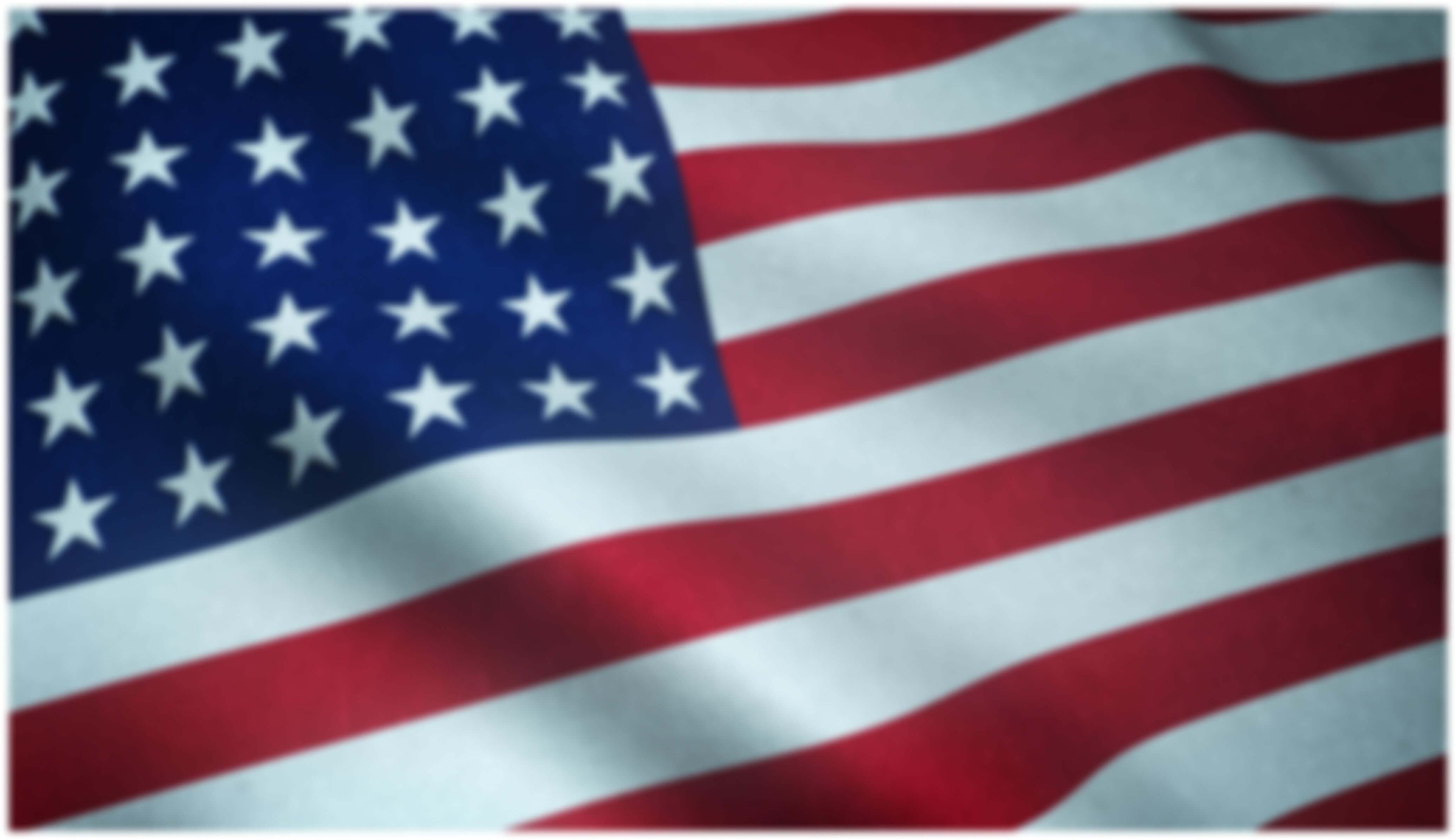 Close-up shot of a waving flag of the United States of America with interesting textures